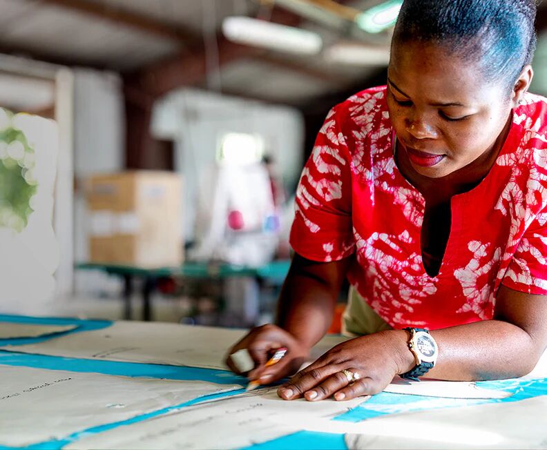 Artisan cutting Androsia batik fabric